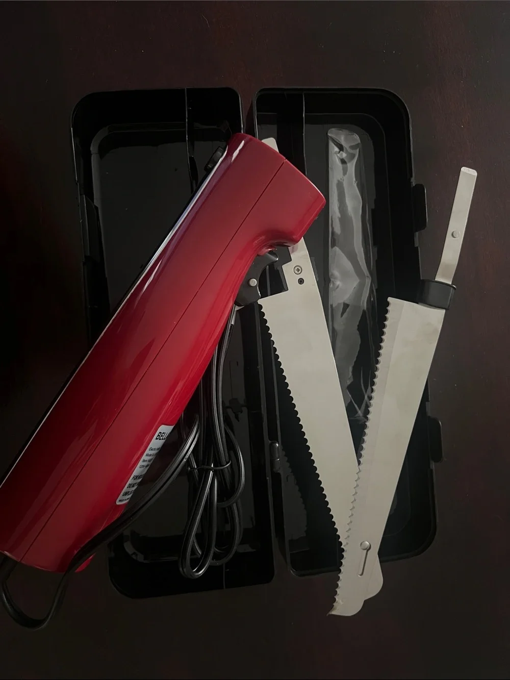 Red Electric Handheld Saw - Compact Corded Cutter